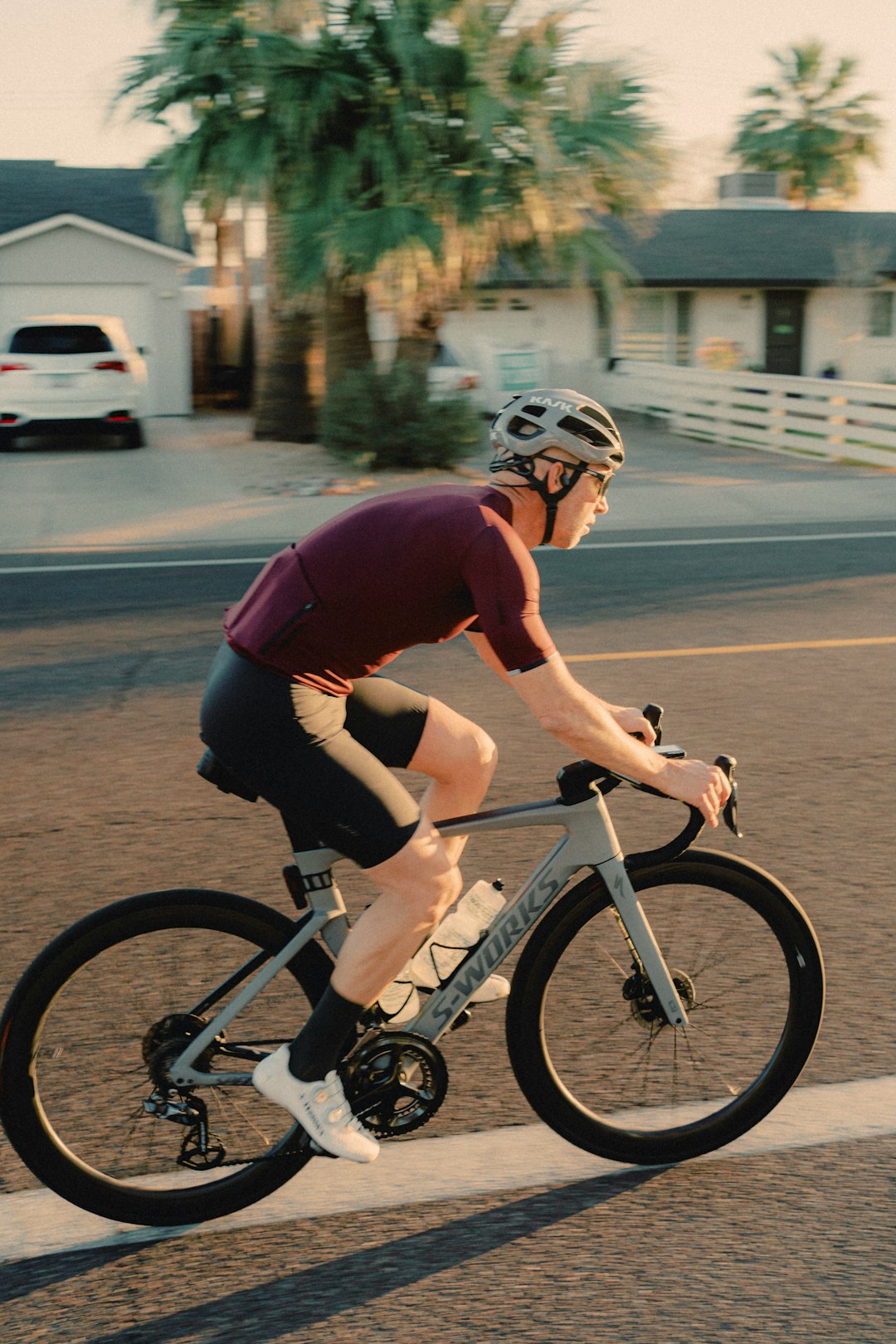 man in red t-shirt riding on bicycle during daytime