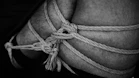 grayscale photo of rope tied on rope
