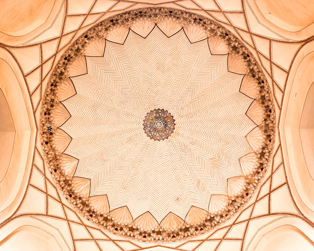 silver round ornament on white and brown textile