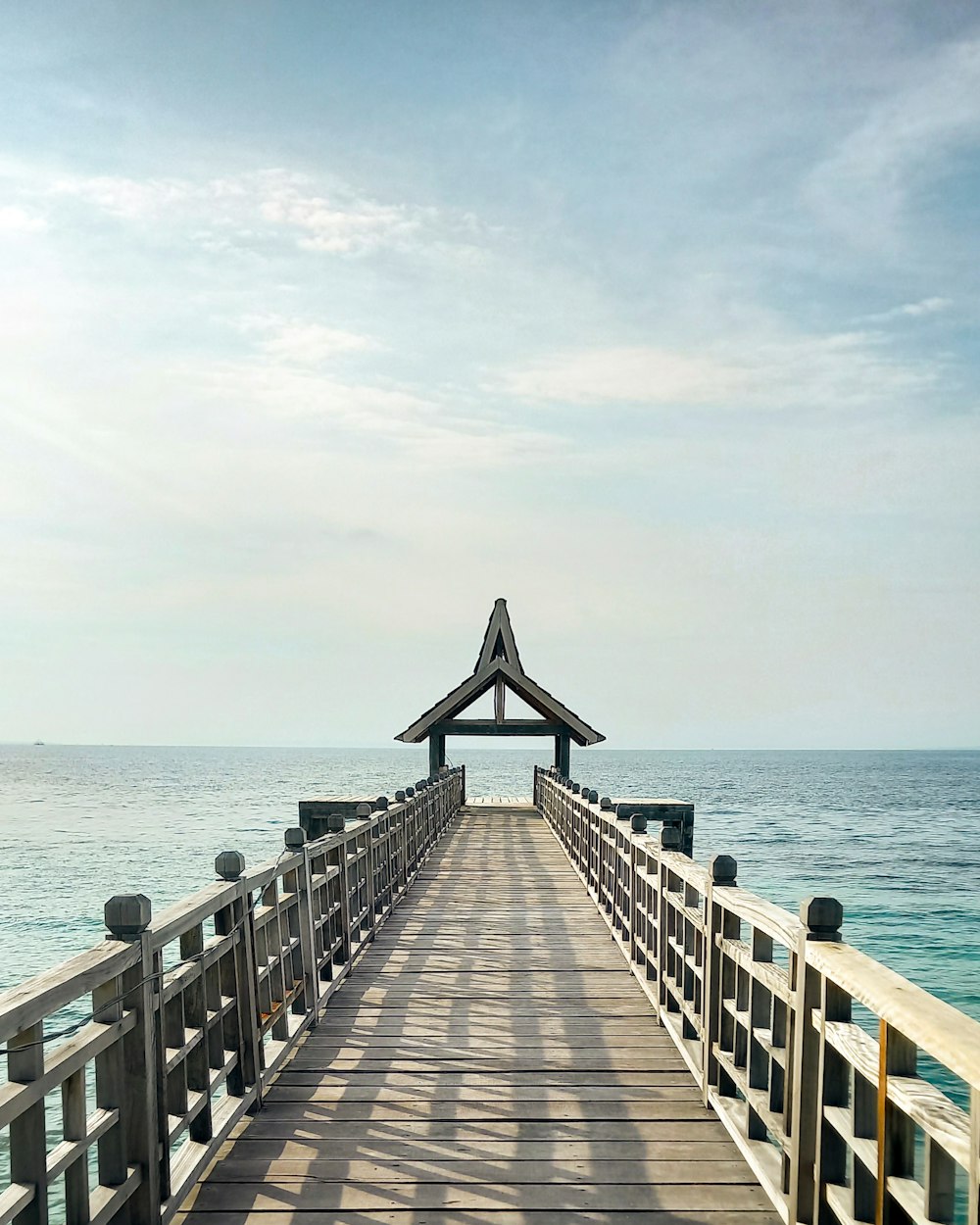 brown wooden dock on sea during daytime