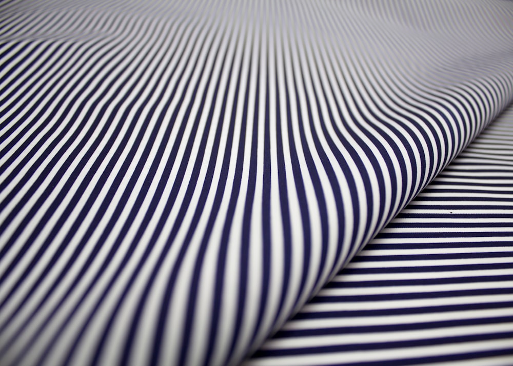 white and black striped textile