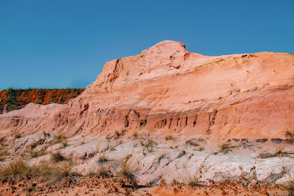 brown rocky mountain under blue sky during daytime