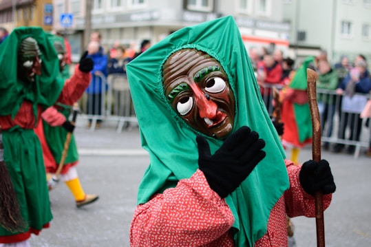 woman in green hijab and red long sleeve dress