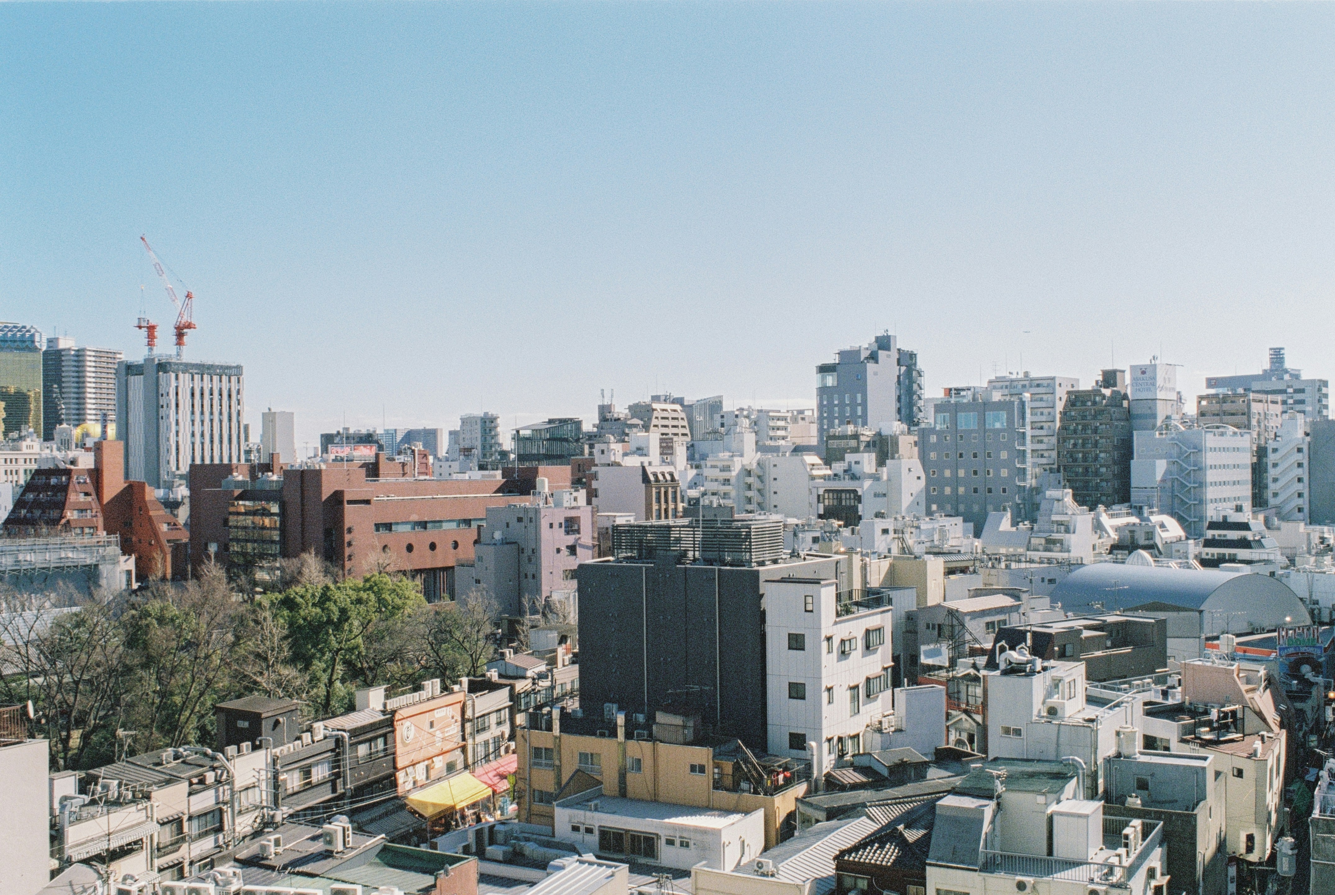 city with high rise buildings under blue sky during daytime
