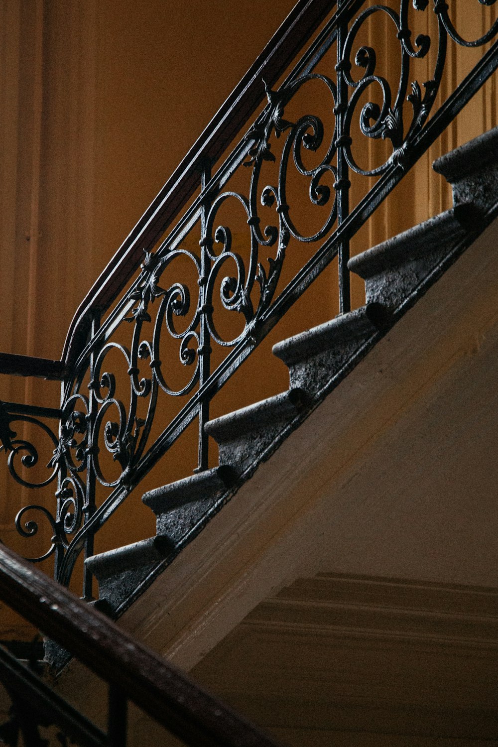 black metal railings on brown wooden staircase