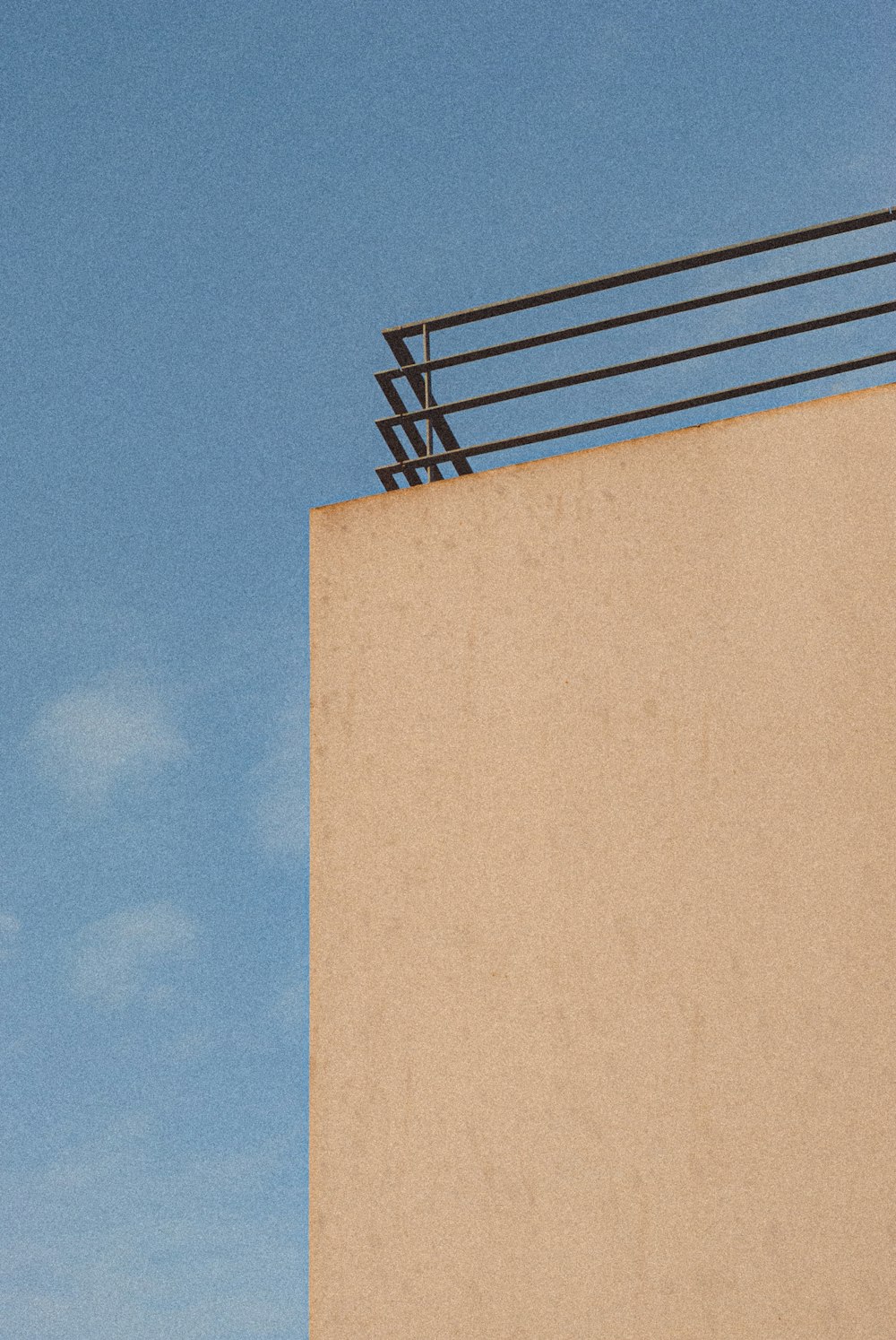 brown concrete building under blue sky during daytime