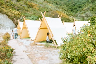 man in black shirt sitting on brown wooden chair