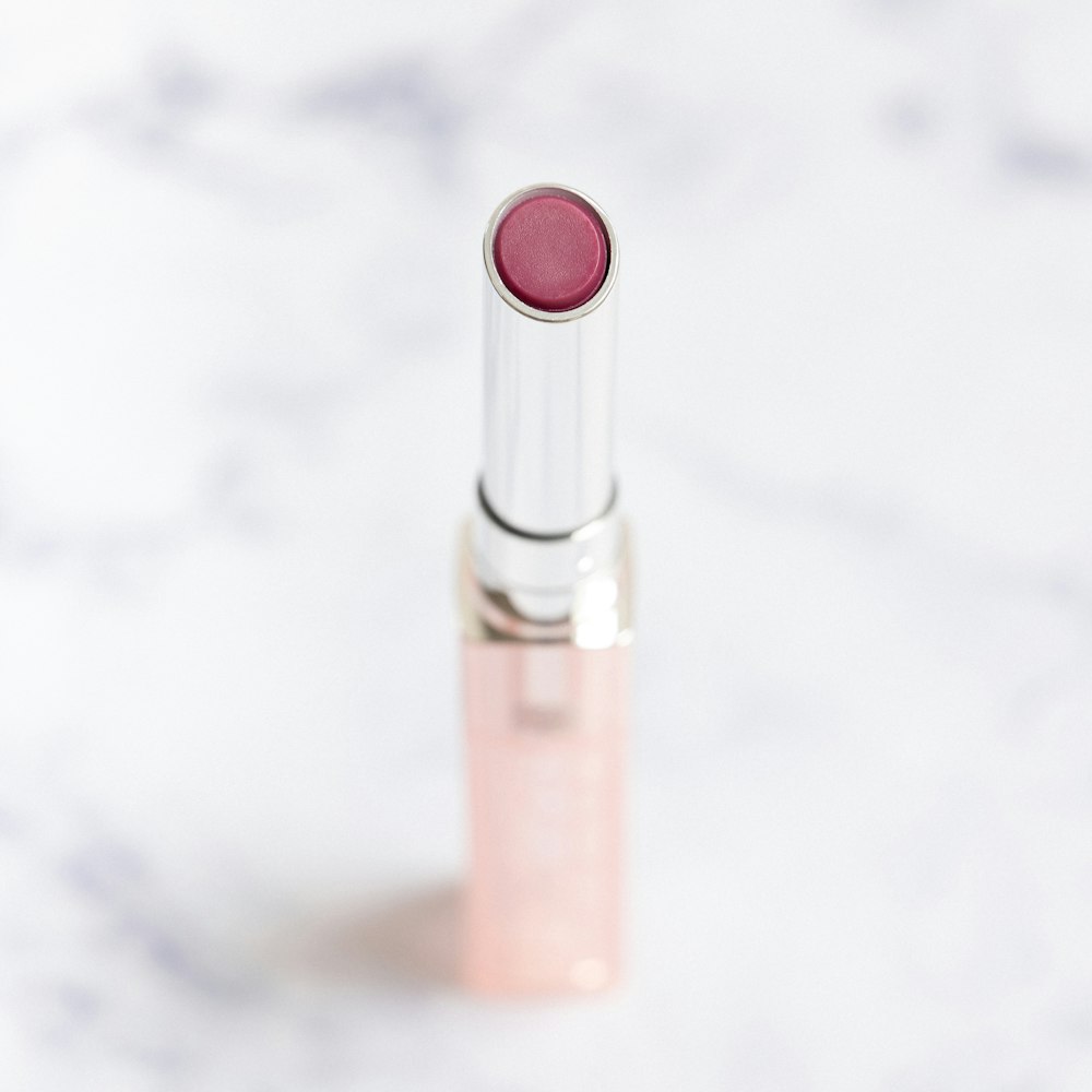 pink lipstick on white surface