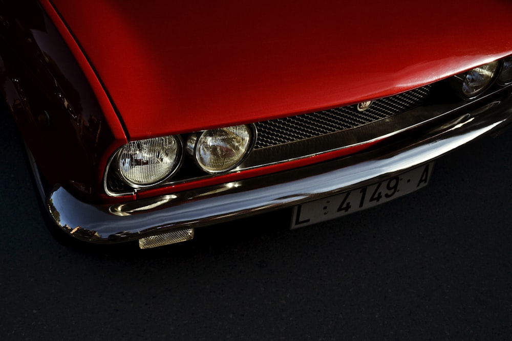 red and silver car in close up photography