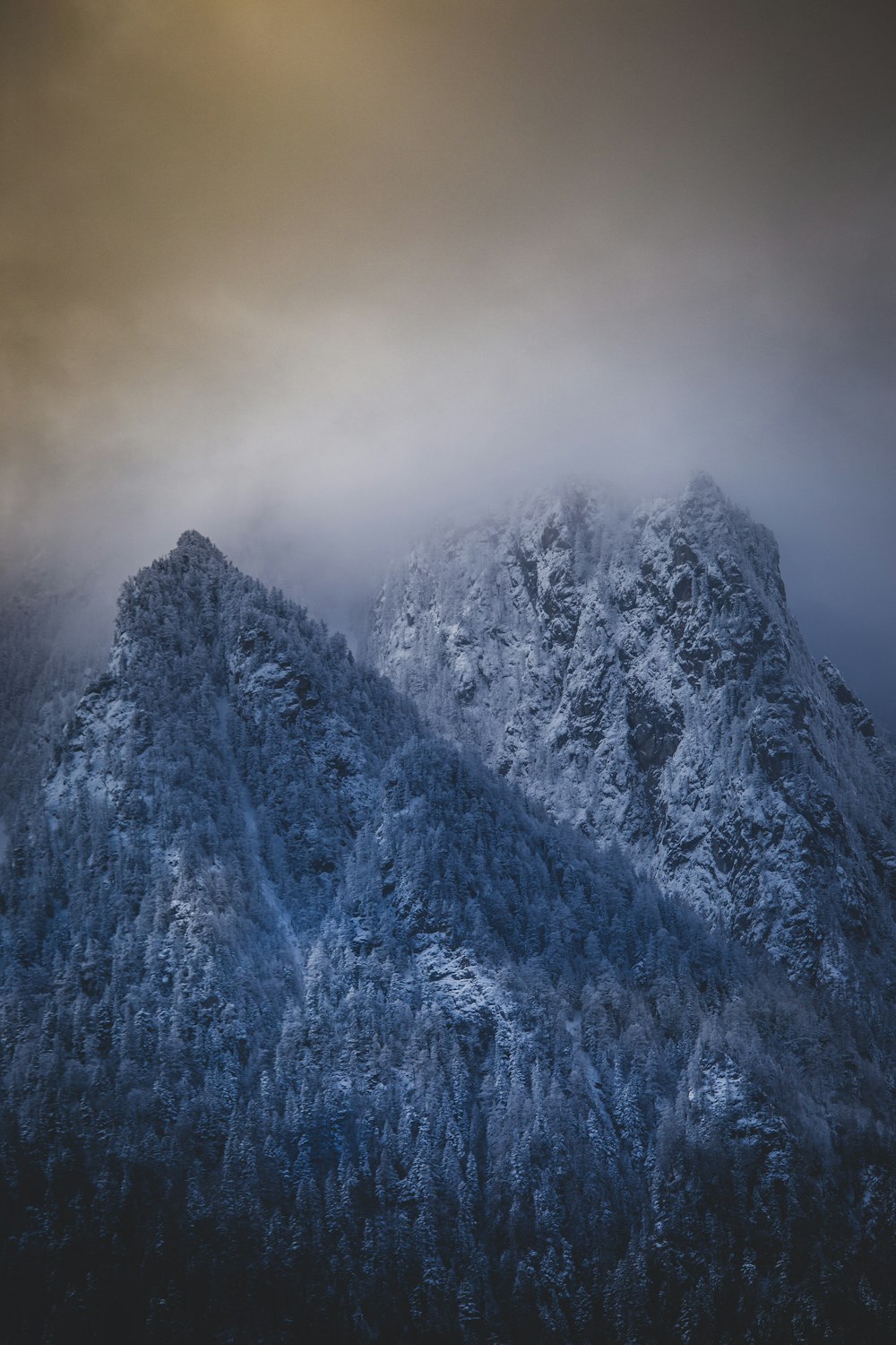 snow covered mountain during daytime