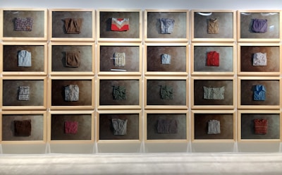 Gallery wall displaying various custom-made clothing items.