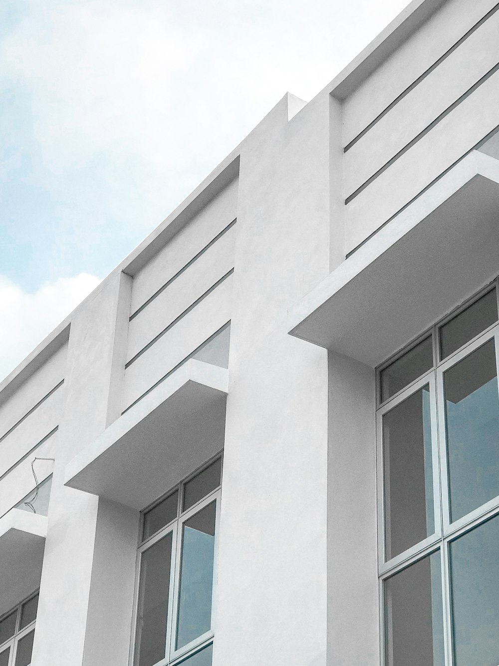 white concrete building under blue sky during daytime