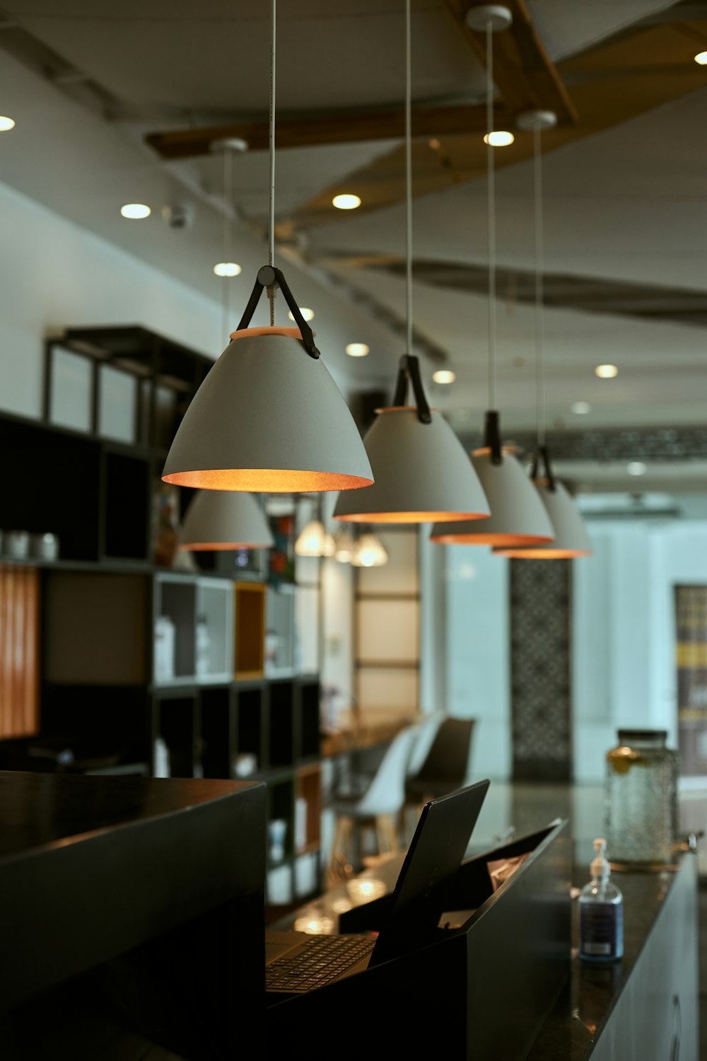 white pendant lamp turned on in room