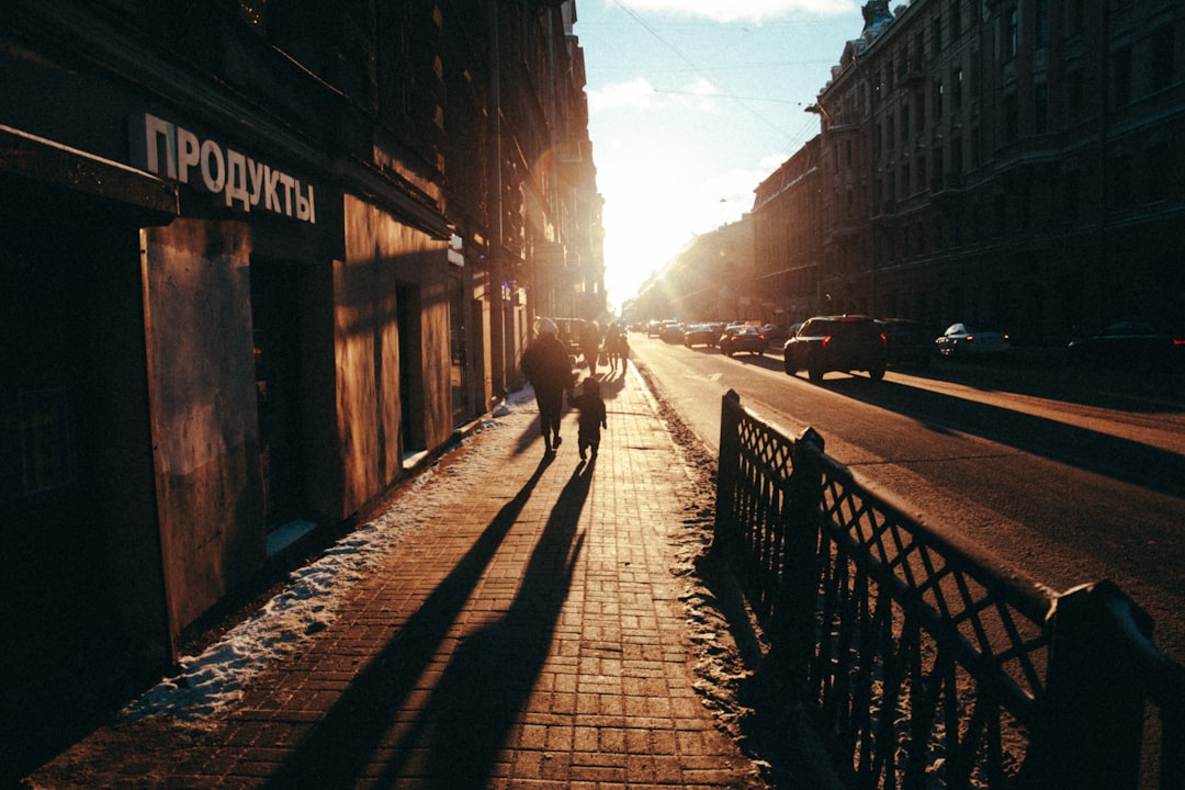 person walking on sidewalk during daytime