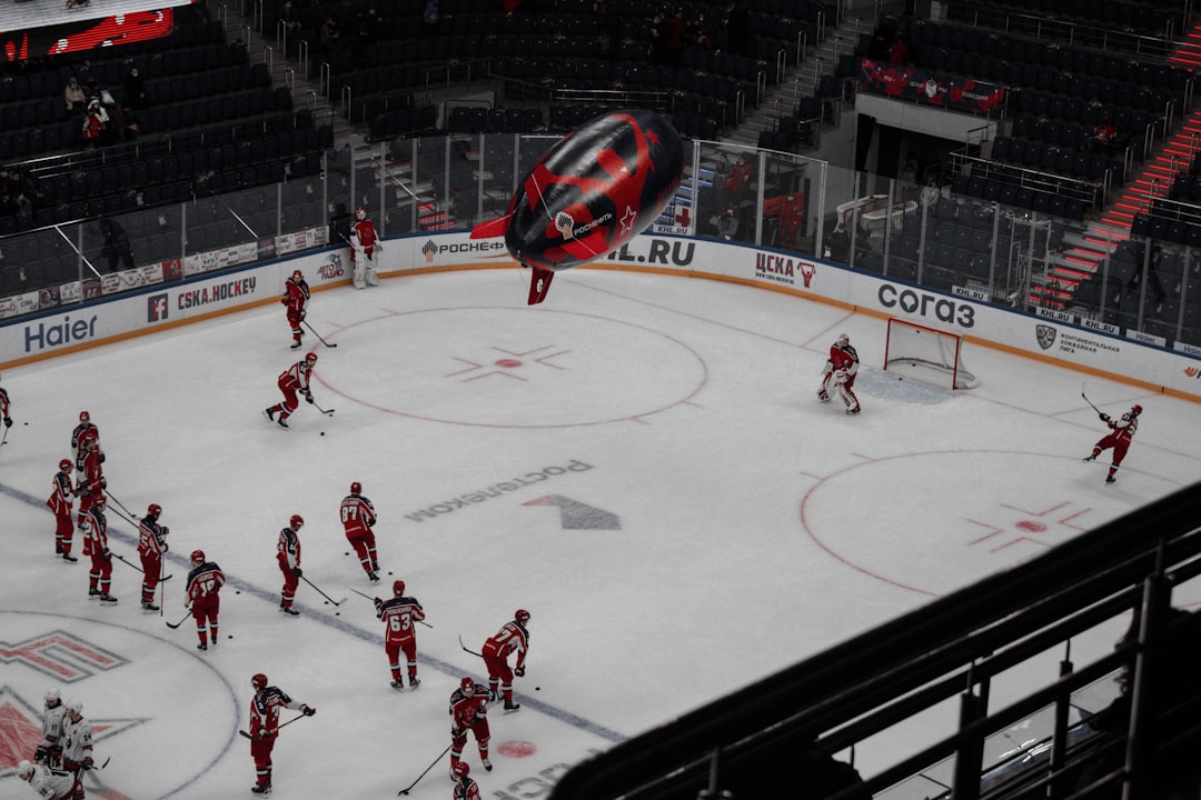 people playing ice hockey on stadium