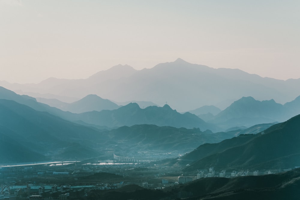 green mountains near body of water during daytime