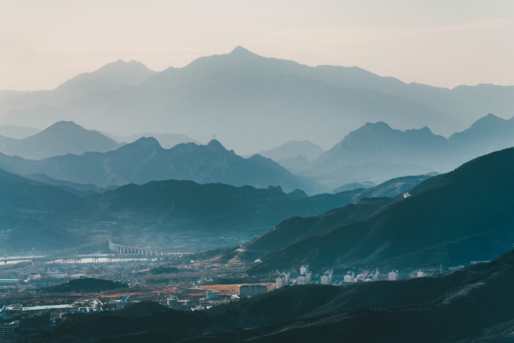 aerial view of city near mountains during daytime