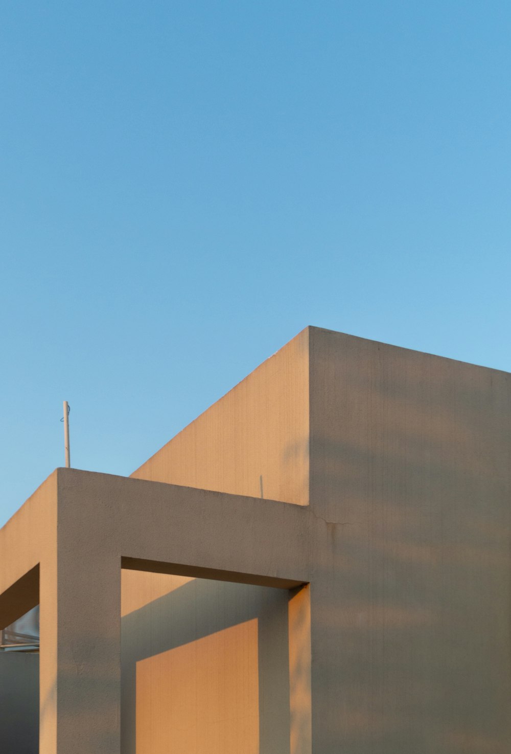 brown concrete building under blue sky during daytime