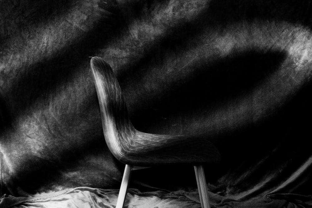 grayscale photo of wooden chair