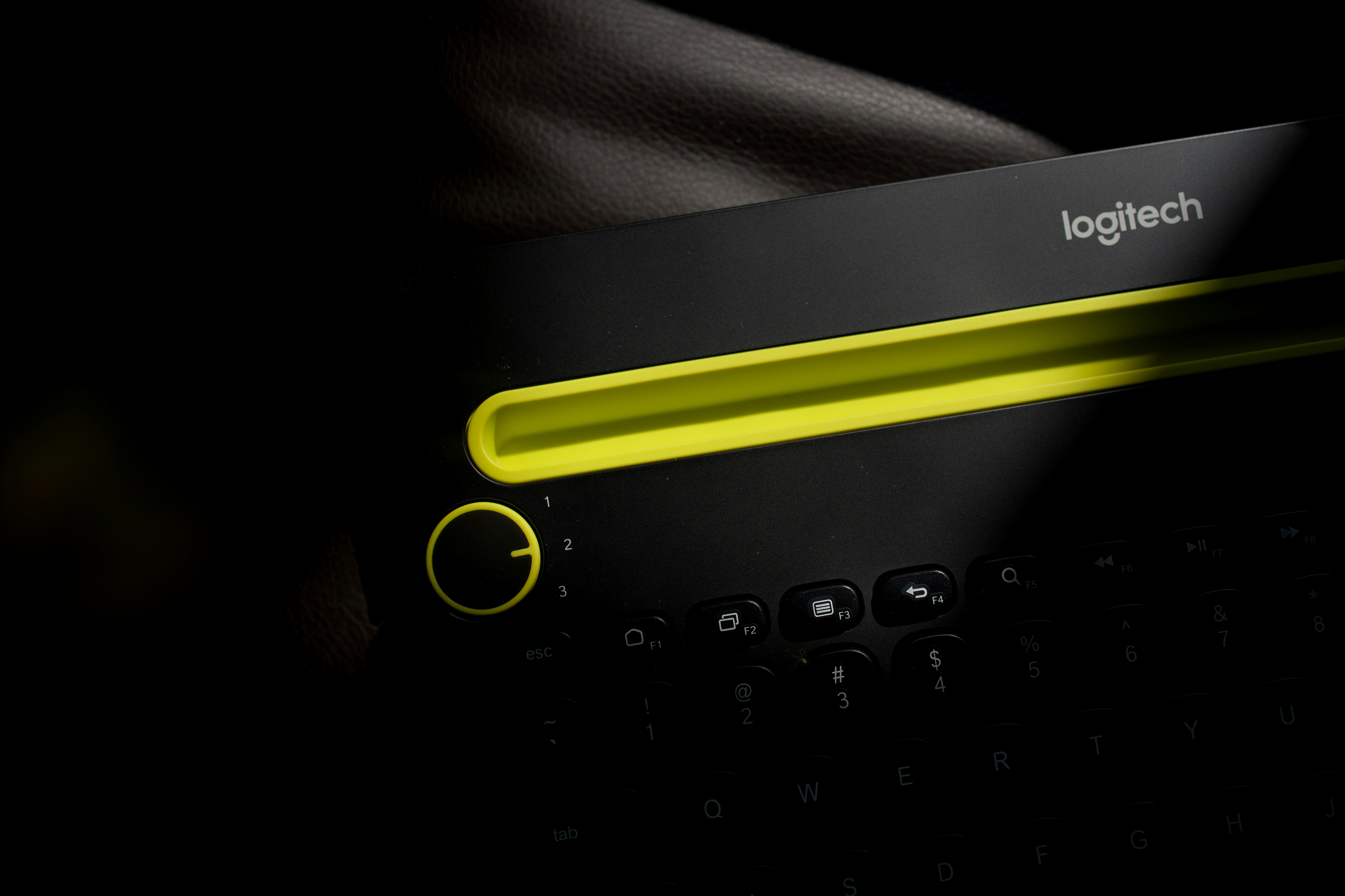 black and yellow logitech keyboard