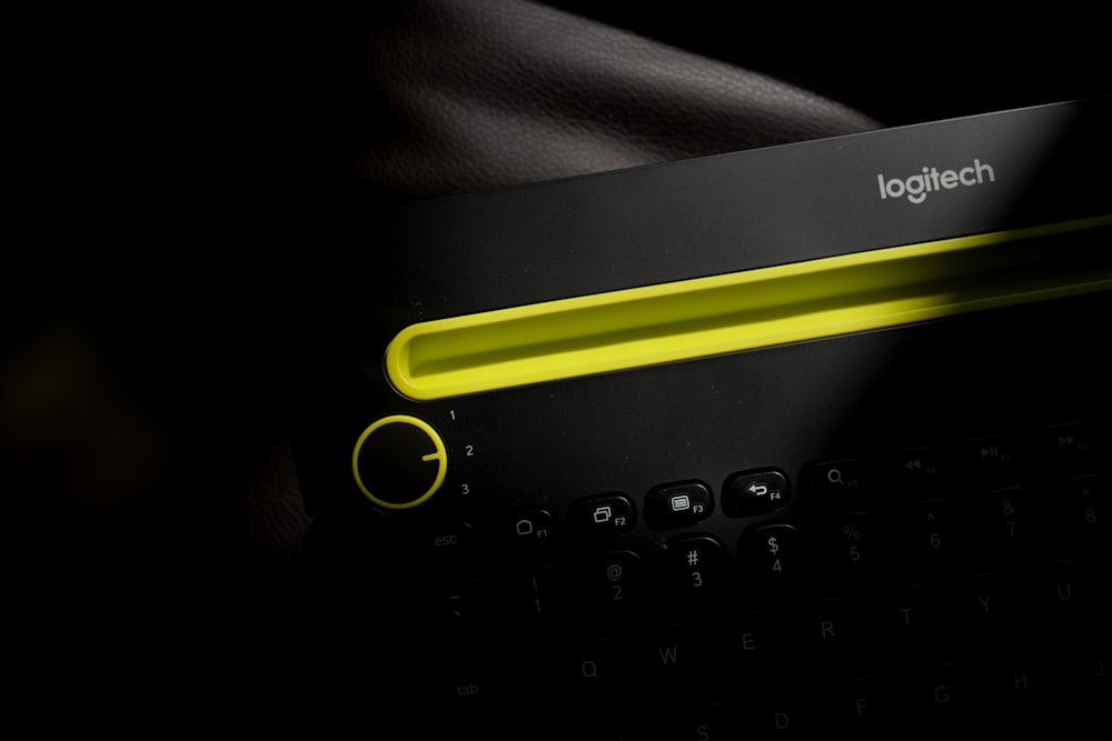 black and yellow logitech keyboard