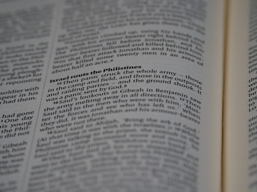 A close-up of the open pages of a book, with text focused on a passage titled 'Israel routs the Philistines'. The text is clear and mostly printed in black, with some headings in bold.