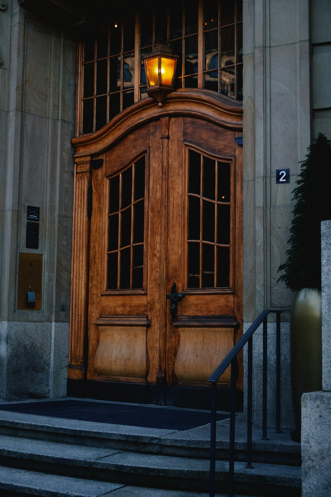 brown wooden door on gray concrete building