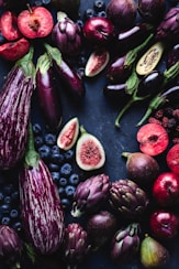 sliced pomegranate fruits on black table