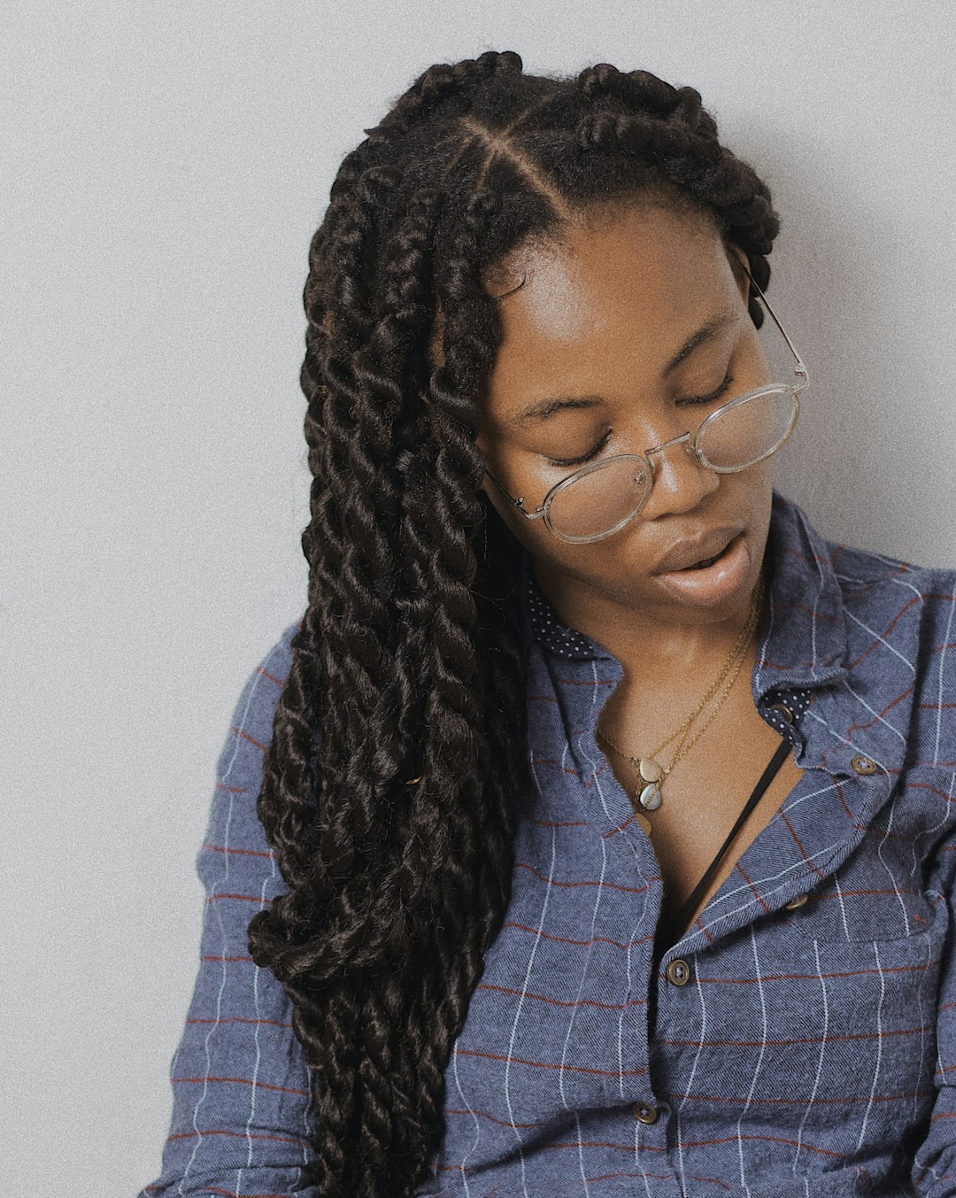 woman in blue and white plaid button up shirt