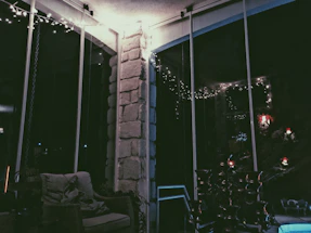 Cozy corner of Ponder Parlor with soft cushions and warm lighting inviting connection.