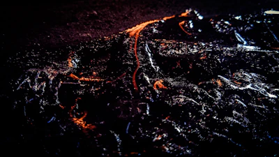 Sleek dark background with bright orange accents highlighting the Growth package features.