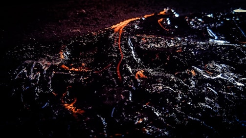 A sleek, dark-themed project showcase with orange highlights.