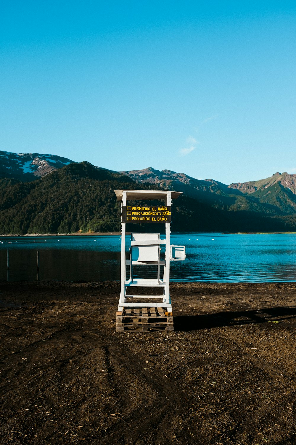 brown wooden dock on lake during daytime