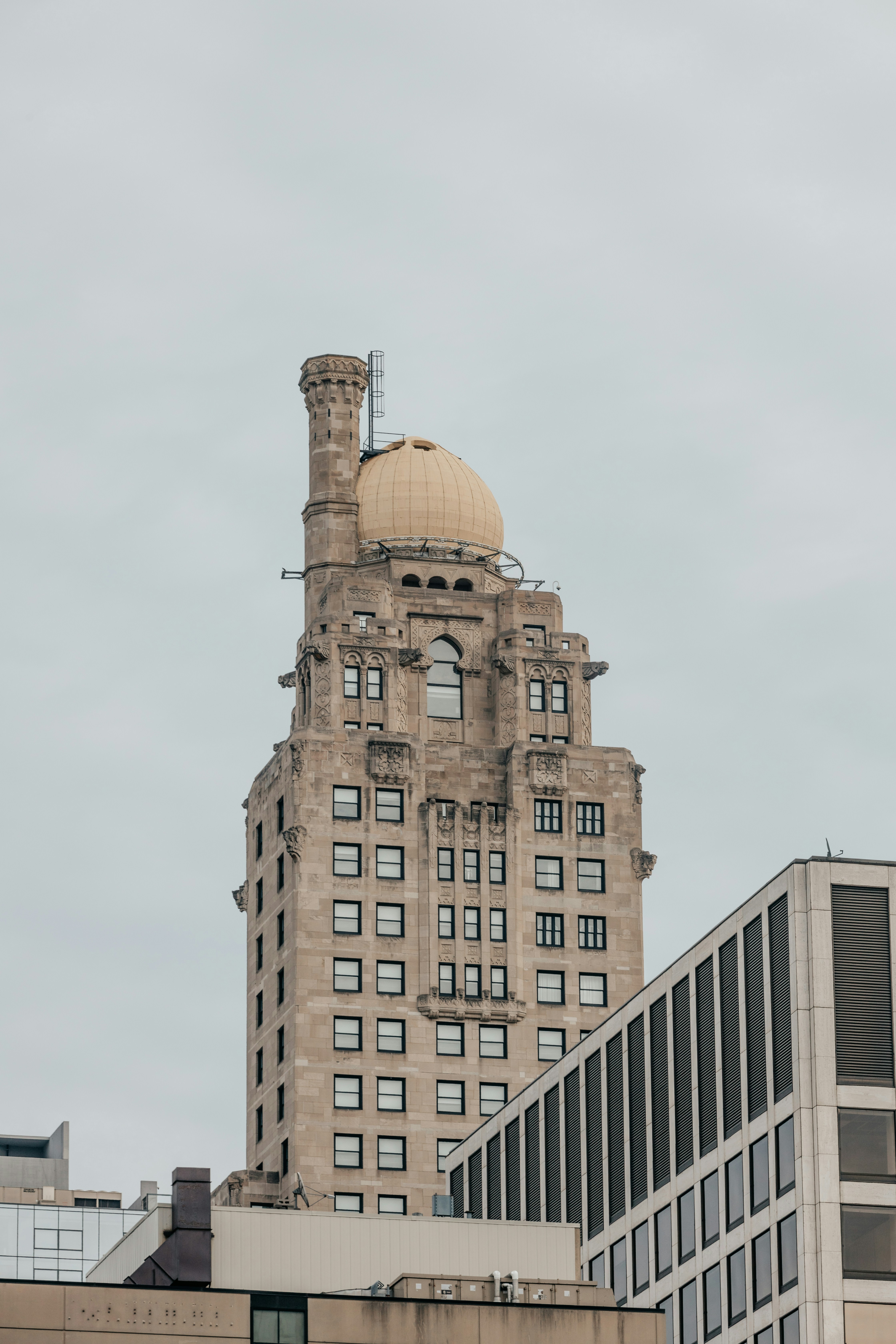 brown concrete building under white sky during daytime