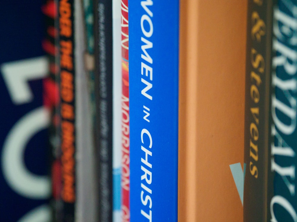 books on brown wooden shelf