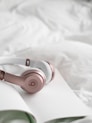 Sleep headphones resting on pillow — designed for light sleepers who need brown noise and gentle amb
