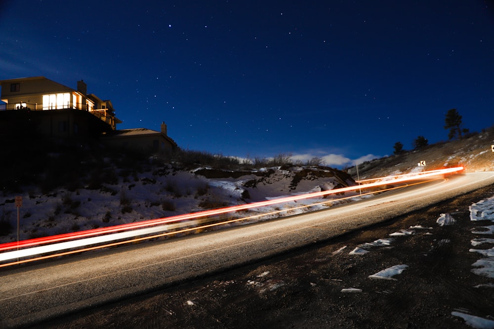 time lapse photography of cars on road during night time