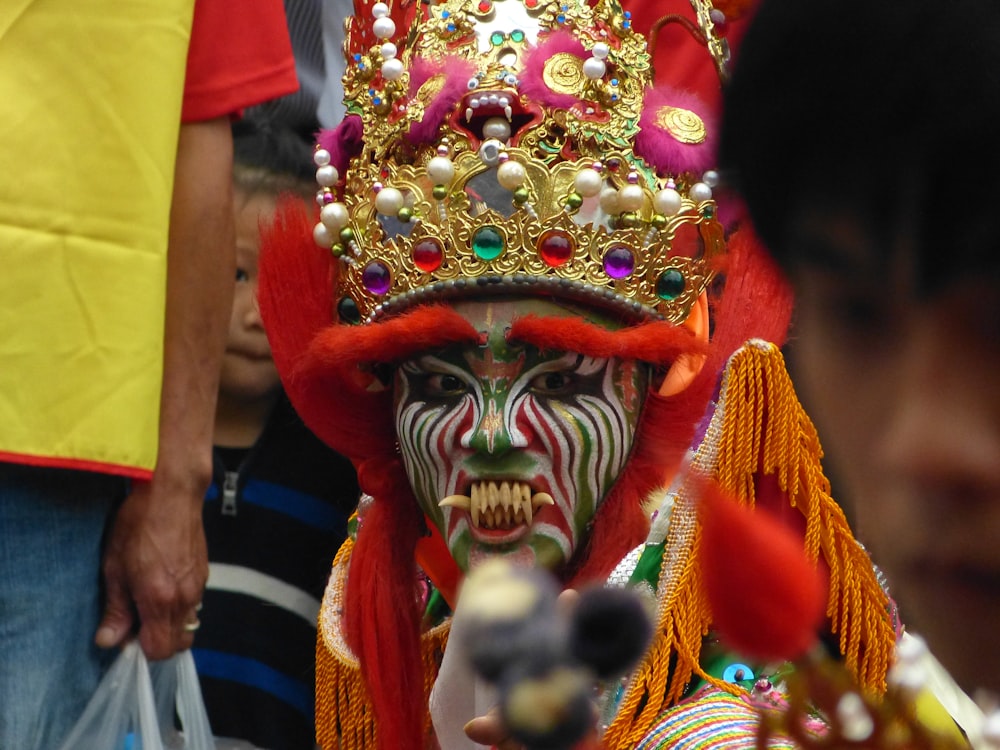 people in red and yellow mask