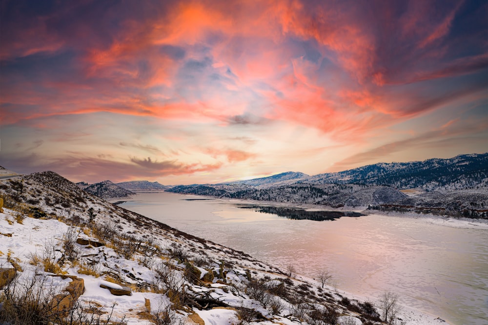 snow covered mountain during sunset