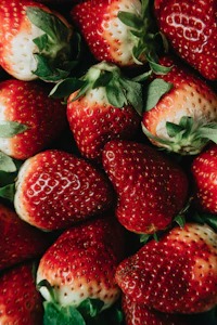 red strawberries on white ceramic plate