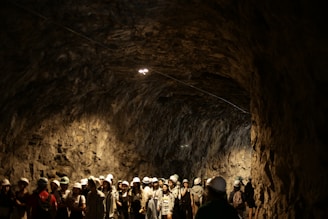 people in a tunnel with lights