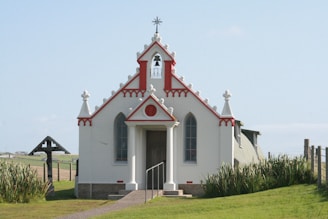 white and red church under white sky during daytime