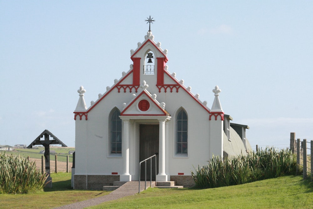 white and red church under white sky during daytime