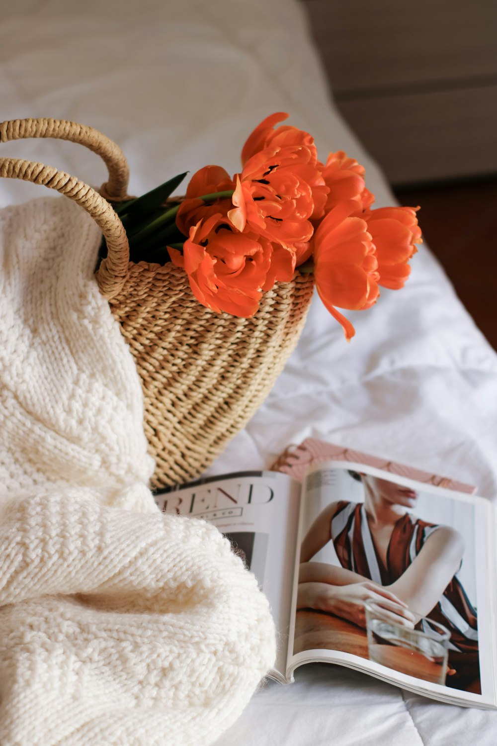 red roses in brown woven basket