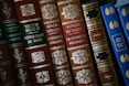 red and brown hardbound books