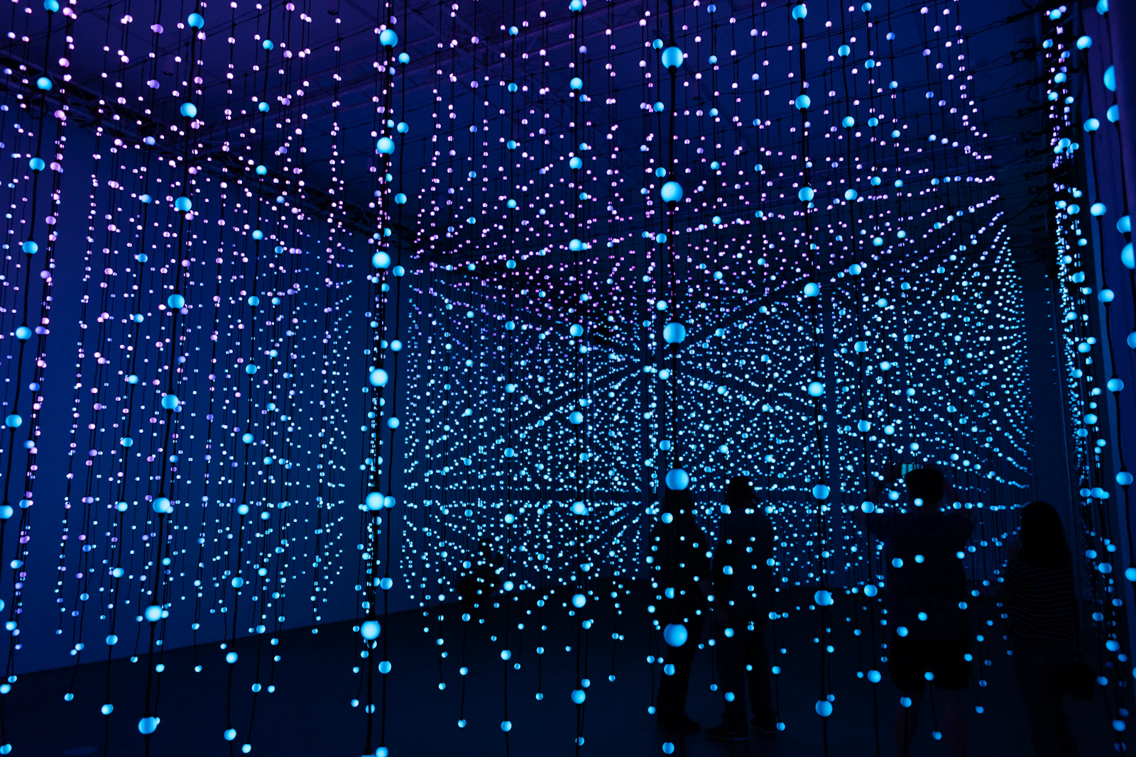 Abstract blue and green light trails, representing the AI ranking and retrieval systems behind AI Overviews and AI Mode