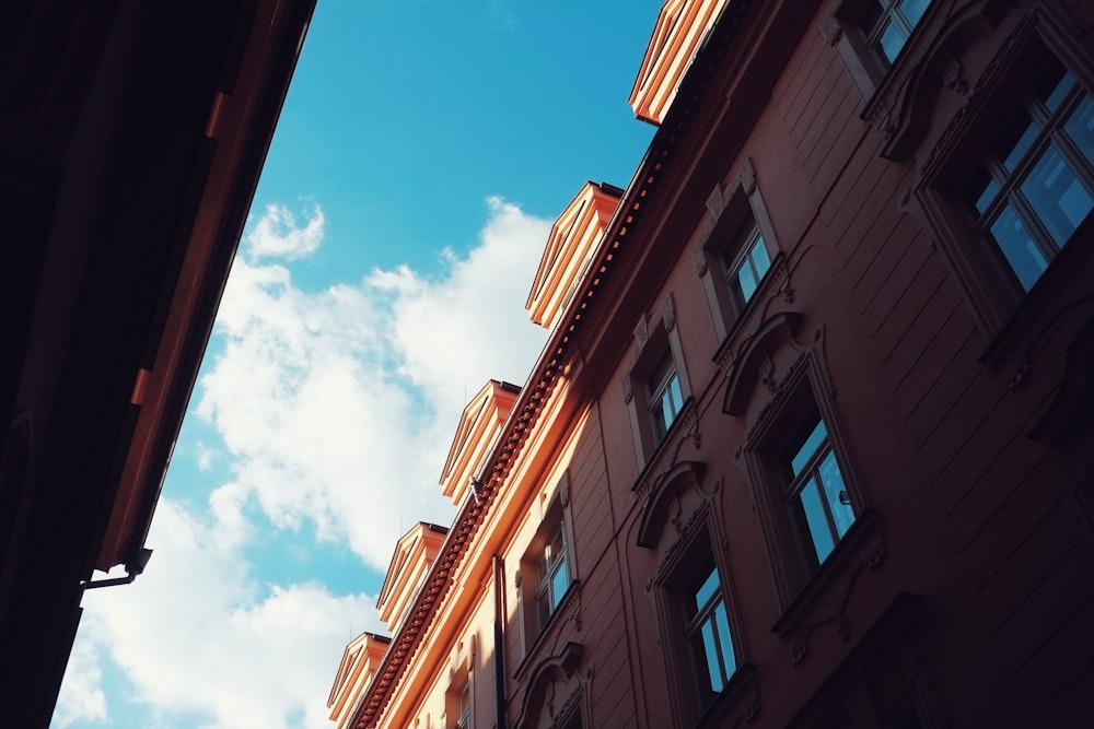 brown concrete building under blue sky during daytime