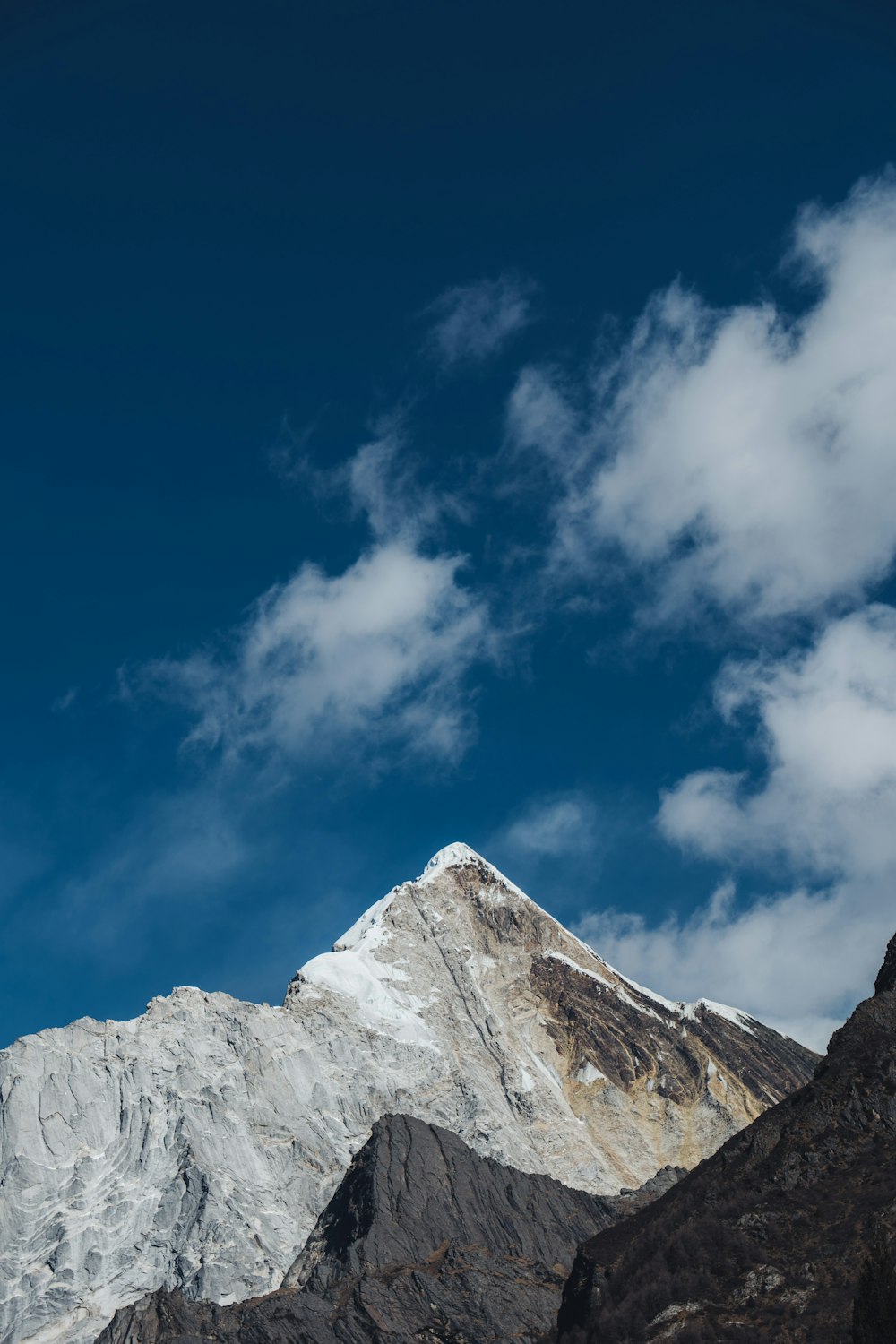 white and gray rocky mountain under blue sky during daytime