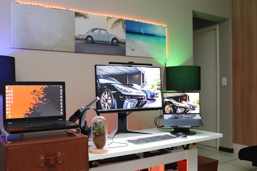 black flat screen computer monitor on brown wooden desk