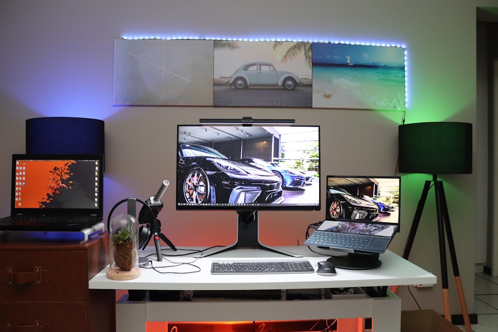 black flat screen computer monitor on brown wooden desk